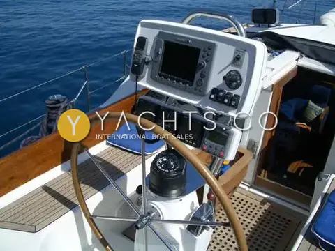 Franchini 45L: helm station with wooden-rimmed wheel, compass and chartplotter on a binnacle pod