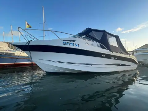 Galeon Galia 700 Walk-around Sport Fisher: starboard bow view of the hull with canopy up, moored in a sunny marina