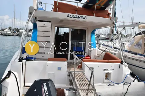 Gulf Craft Oryx 46 Fly: stern view showing the swim platform, passerelle, outboard on the tender and steps up to the cockpit