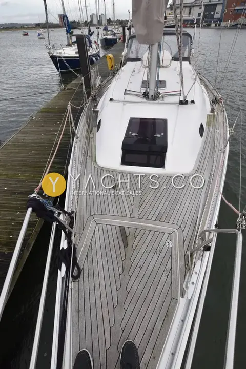 Hanse 370: teak-laid cockpit floor looking forward to the coachroof hatch, moored at a pontoon