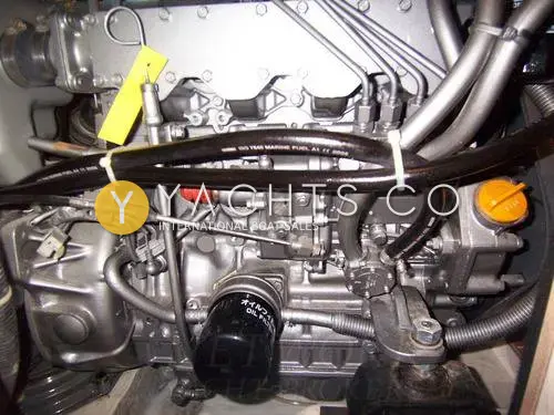 Hanse 411: engine bay showing the clean four-cylinder diesel with oil filter and fuel lines