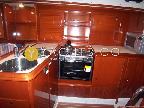 Hanse 411: galley with twin stainless sinks, two-burner gas cooker with oven and microwave