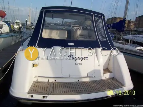 Hardy Marine Seawings 355: stern view showing name Voyager, teak bathing platform and navy blue aft canopy