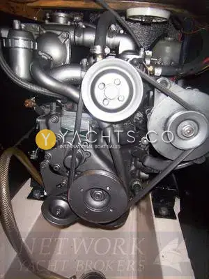 Hunter Channel 32: engine bay showing the grey Yanmar diesel with belts and pulleys