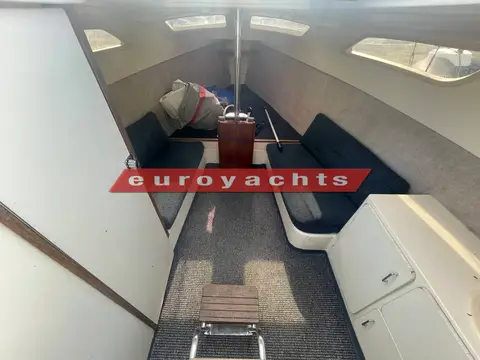 Hunter Legend 25 Trailer Sailer: view down into the open-plan cabin with blue settees and grey carpet