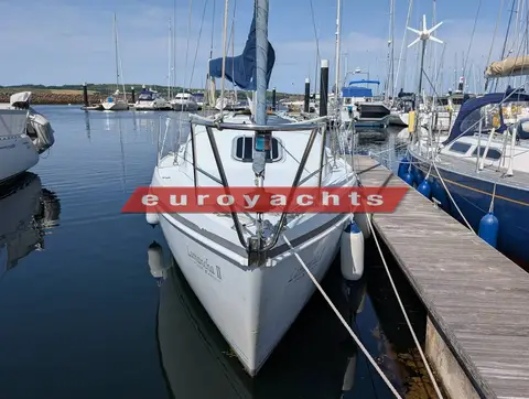 Hunter Ranger 265: bow view in her berth showing pulpit, furled jib and calm marina water