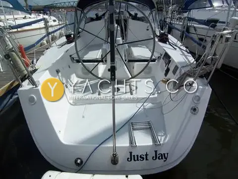 J Boats J/109: open transom and cockpit with large wheel and folding swim ladder, berthed in marina