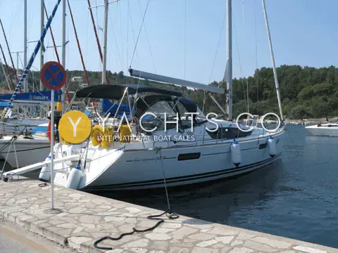 Jeanneau 42 DS: starboard quarter view moored stern-to on a stone quay, bimini and sprayhood up