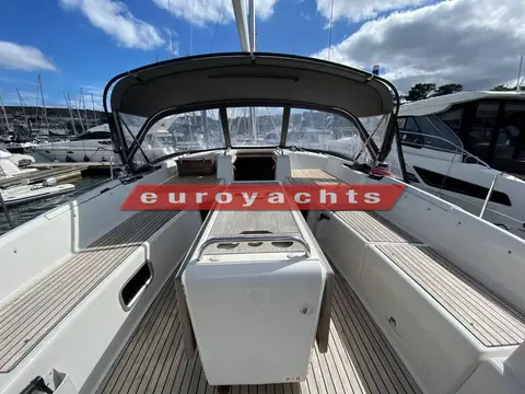 Jeanneau 51: cockpit looking forward to the sprayhood, with teak seats and a central table