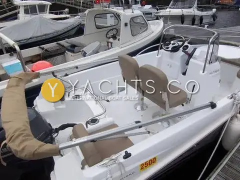 Jeanneau Cap Camarat 4.7C.C: aft cockpit with twin helm seats, stern bench seating and outboard with folded bimini