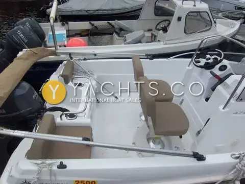 Jeanneau Cap Camarat 4.7C.C: cockpit from above showing helm seats on pedestals, stern seats and console