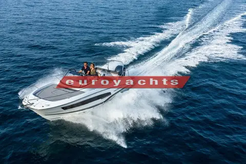 Jeanneau Cap Camarat 7.5 WA: running at speed on open blue water with a wide wake and people at the helm
