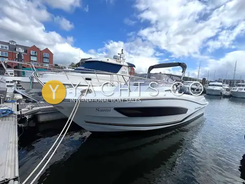 Jeanneau Cap Camarat 7.5 WA S2: moored alongside a pontoon in a marina, showing hull side window and arch