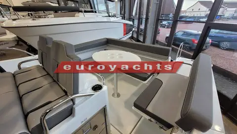 Jeanneau Cap Camarat 7.5 WA S3: aft cockpit with grey bench seating around a round white table