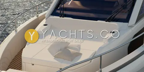 Jeanneau DB 37: foredeck sunpad with white cushions and cushion, stainless guardrail alongside