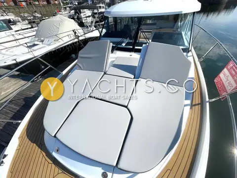 Jeanneau Merry Fisher 1095: front sundeck cushions laid flat ahead of the wheelhouse windscreen