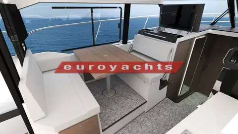 Jeanneau Merry Fisher 1095 Coupe Serie 2: wheelhouse saloon with light upholstered seating around a wooden table and large side windows