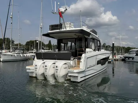 Jeanneau Merry Fisher 1295 Fly: stern view showing three white outboard engines and the aft cockpit