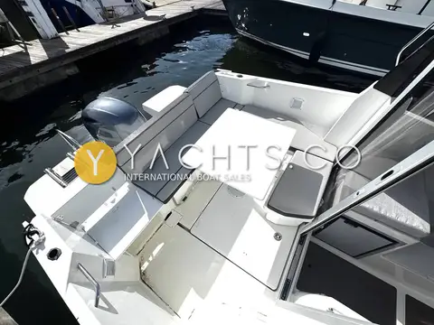 Jeanneau Merry Fisher 605 S2: aft cockpit from above with U-shaped seating, table and open wheelhouse door