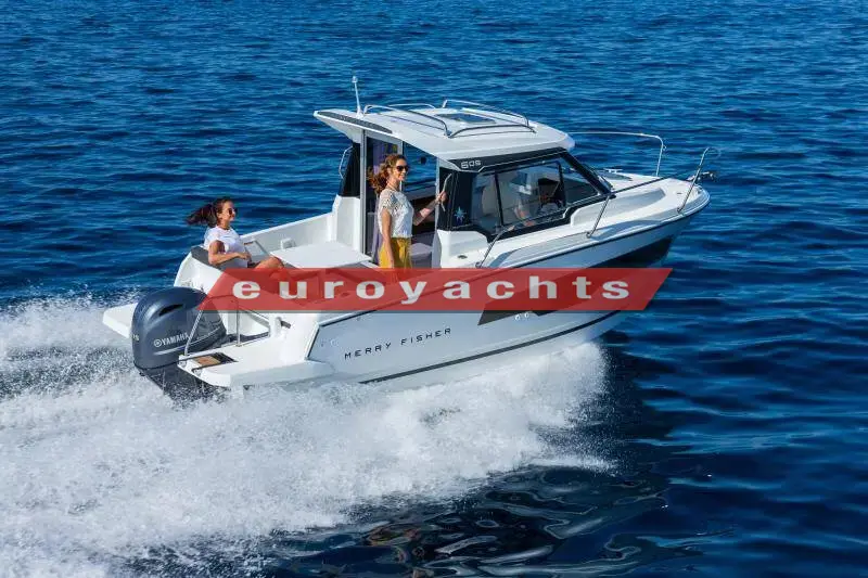 Jeanneau Merry Fisher 605 Serie 2: white wheelhouse motor boat under way at speed on blue sea with outboard and two people aboard