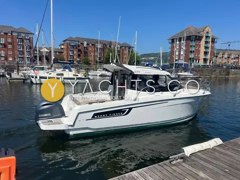 Jeanneau Merry Fisher 695: stern quarter view showing outboard, cockpit and wheelhouse beside a pontoon