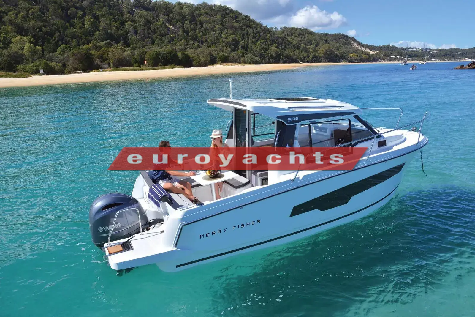 Jeanneau Merry Fisher 695: white hull with wheelhouse and single outboard under way in clear turquoise water