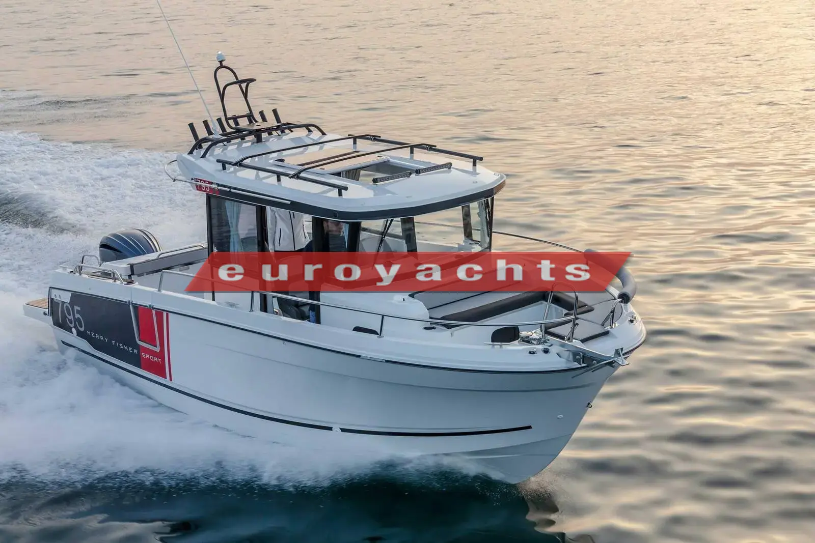 Jeanneau Merry Fisher 795 Sport: white hull with red side panel under way at speed, wheelhouse with roof rack and single outboard