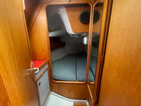 Jeanneau Olympic Sea 42 Sun Legend Hull: aft cabin doorway showing the double berth with grey cushions
