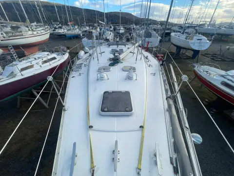 Jeanneau Olympic Sea 42 Sun Legend Hull: coachroof and foredeck from the mast looking forward, with hatch and boats ashore around