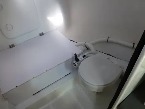 Jeanneau Sun Fast 3300: forward heads compartment with manual sea toilet and white moulded interior