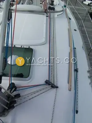 Jeanneau Sun Odyssey 32 Legend: coachroof with deck hatch, lines led aft to clutches and a wooden grab rail