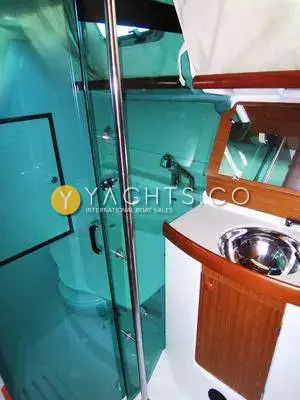 Jeanneau Sun Odyssey 35 Yacht For Sale: heads with green glass shower screen, stainless round basin and wooden vanity