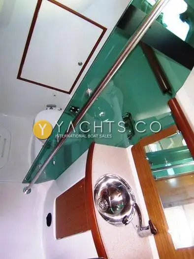 Jeanneau Sun Odyssey 35 Yacht For Sale: heads from above showing toilet, glass shower screen, steel basin and grab rail