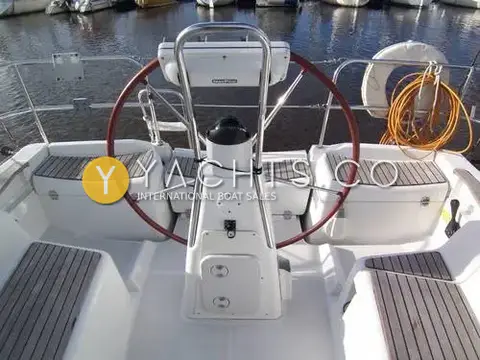 Jeanneau Sun Odyssey 36I: cockpit from astern with large wheel, teak-topped seats and instrument pod