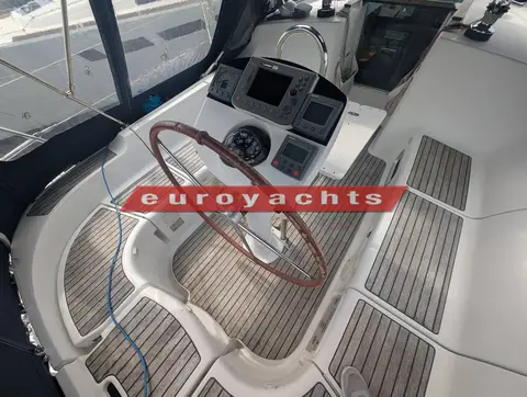 Jeanneau Sun Odyssey 37 Legende: cockpit with wooden-rimmed wheel, binnacle instruments and teak-laid seats and sole