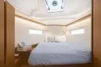 Jeanneau Sun Odyssey 380: forward cabin with made-up double berth, overhead opening hatch and hull portlights
