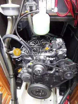 Jeanneau Sun Odyssey 40: engine bay showing the Yanmar diesel, belts, filters and coolant header tank
