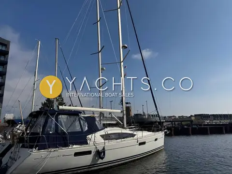 Jeanneau Sun Odyssey 42 DS: masts and rigging above the yacht in a marina under a clear blue sky