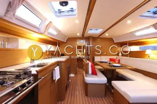 Jeanneau Sun Odyssey 44I: saloon with linear galley to port, U-shaped seating to starboard and teak-style interior