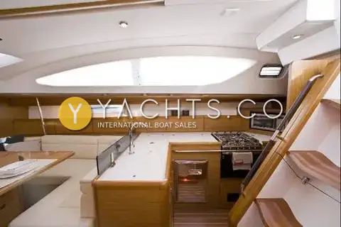 Jeanneau Sun Odyssey 50 DS- 360 Docking With: galley with sink, gas hob and oven beside the saloon seating and companionway steps