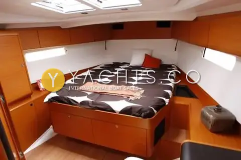 Jeanneau Sun Odyssey 509- 3 Cabins: double berth cabin with patterned bedspread, overhead hatches and storage drawers beneath