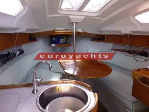 Jeanneau Sunway 25: saloon from galley sink towards forward berth, dining table and skylights above