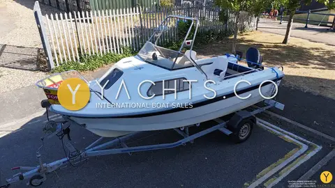 Kingfisher 166 Sports Fisher: port side of the hull on its trailer showing cuddy window and outboard at the stern