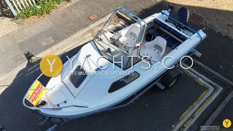Kingfisher 166 Sports Fisher: overhead view showing cuddy roof, windscreen, twin helm seats and rear bench in the cockpit
