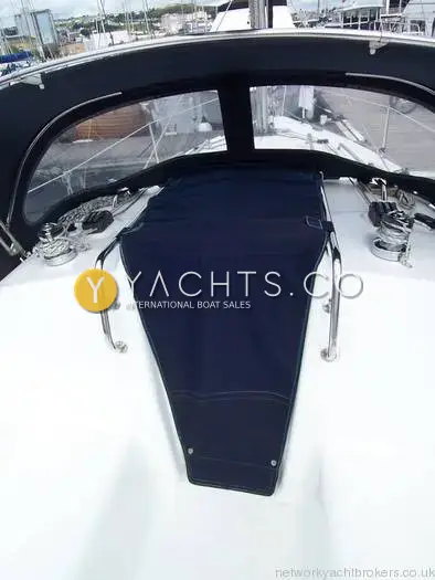 Legend 27: navy spray hood and companionway cover seen from the cockpit, marina beyond