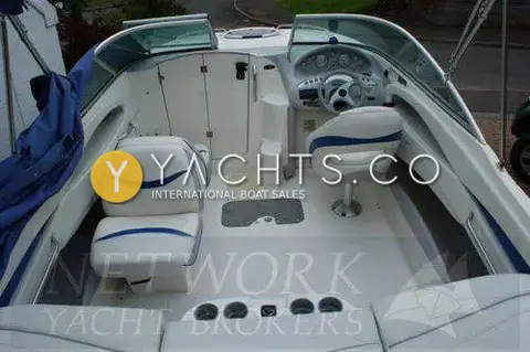 Maxum 2100 SC: cockpit from above showing helm, reclining port seat, cabin door and aft drink holders