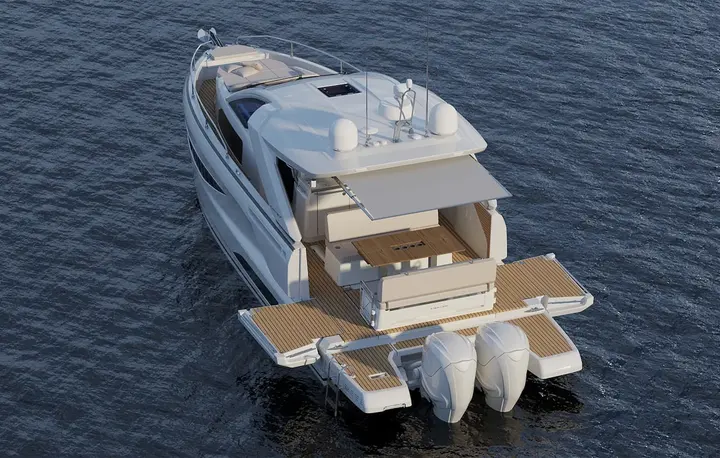 Jeanneau DB 37 OB: aerial stern view showing teak cockpit, fold-out side terraces, bathing platform and twin outboard engines