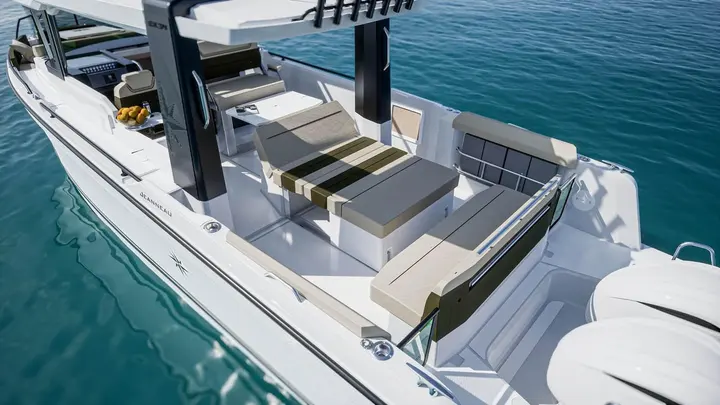 Jeanneau EX 34 Hardtop: aft cockpit from above with beige cushioned seating, folding backrest and hardtop supports