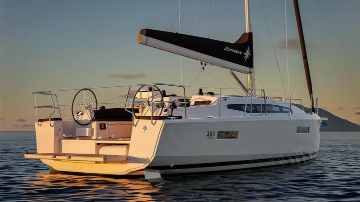 Jeanneau Sun Odyssey 385: stern three-quarter view showing twin wheels, open transom and lowered bathing platform at dusk