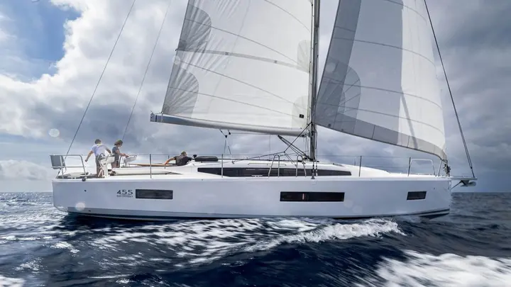 Jeanneau Sun Odyssey 455: under sail in choppy water, full mainsail and headsail set, crew in the cockpit
